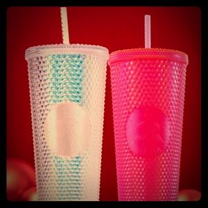 Pink and white studded Starbucks Cups
